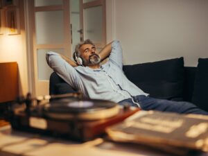 A man relaxing while listening to music.
