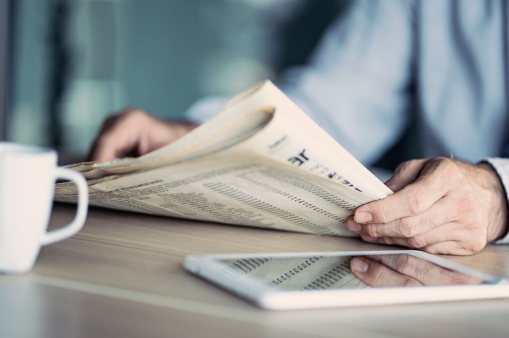A man reading a newspaper.