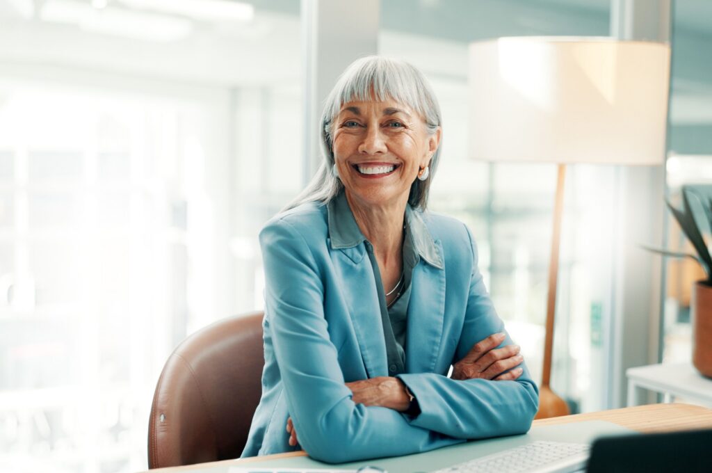 A female business owner sitting at a desk.